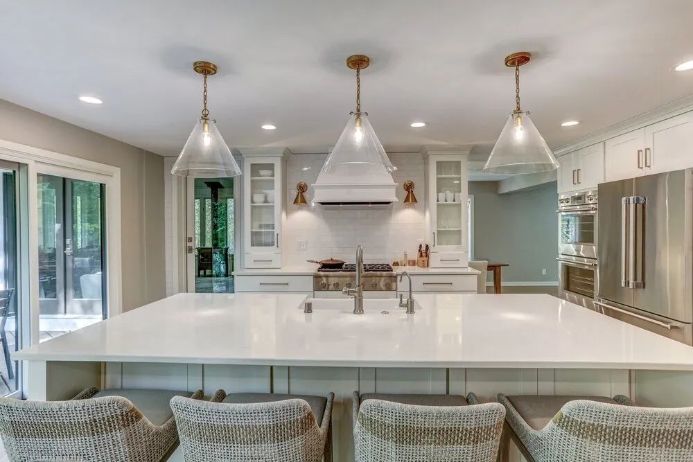 There is a large island in the middle of the kitchen.