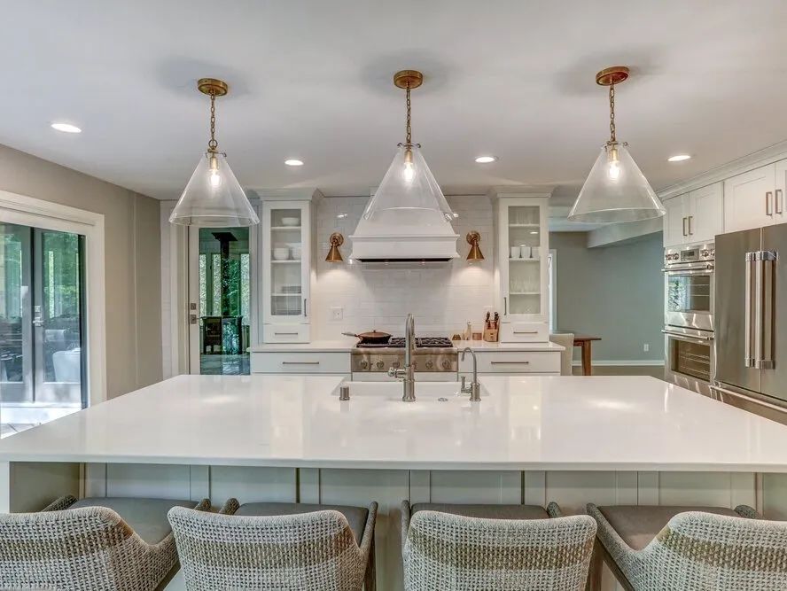 There is a large island in the middle of the kitchen.