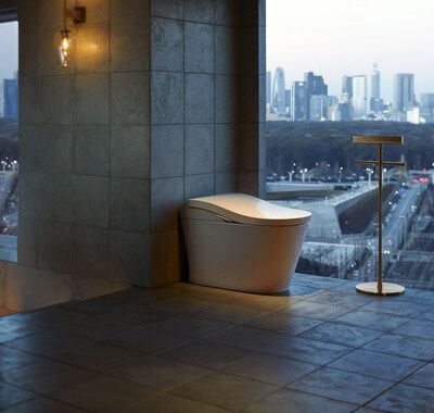 large modern bathroom with smart toilet by toto