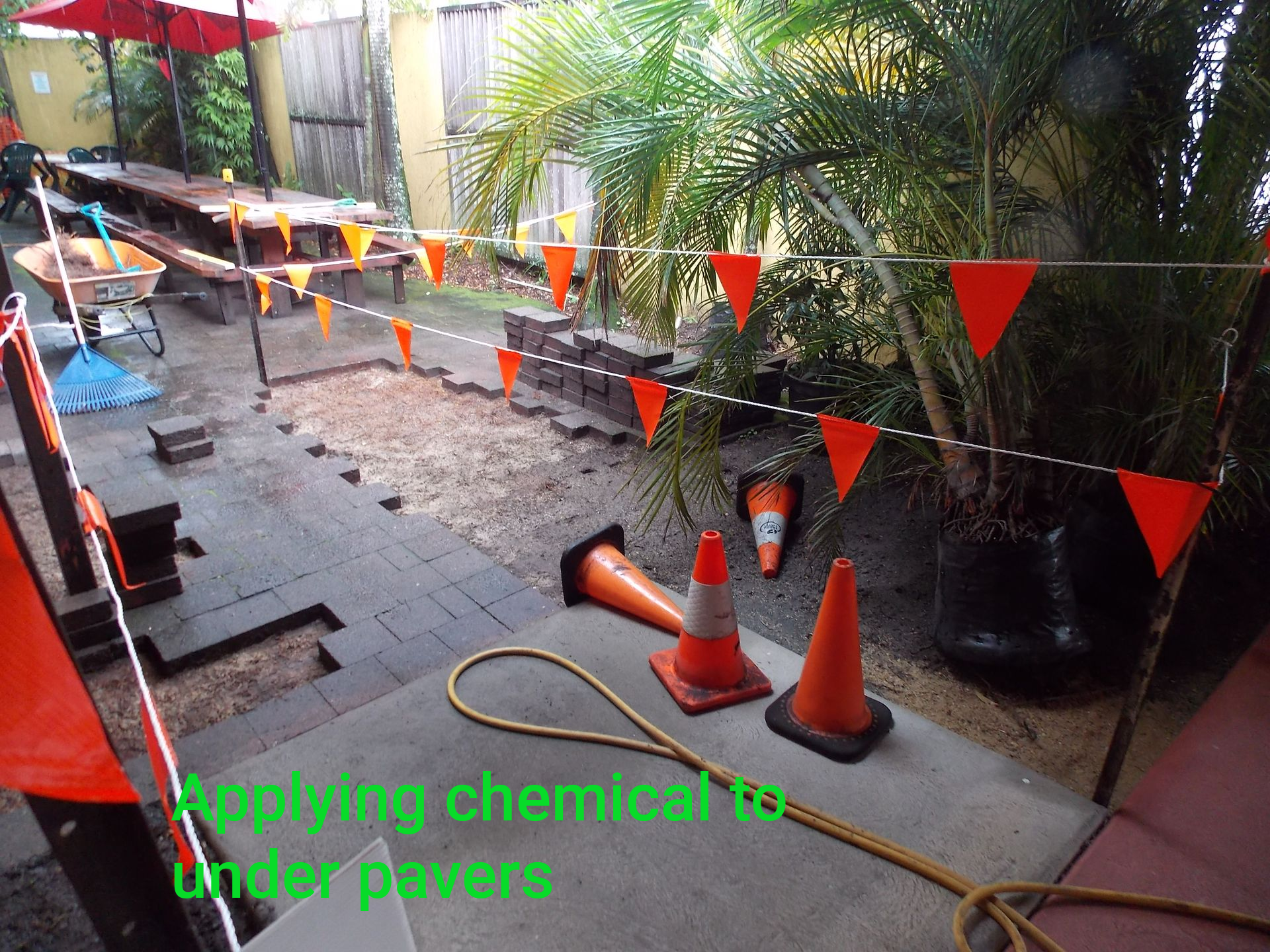 Drilling holes in floor to inject termite control