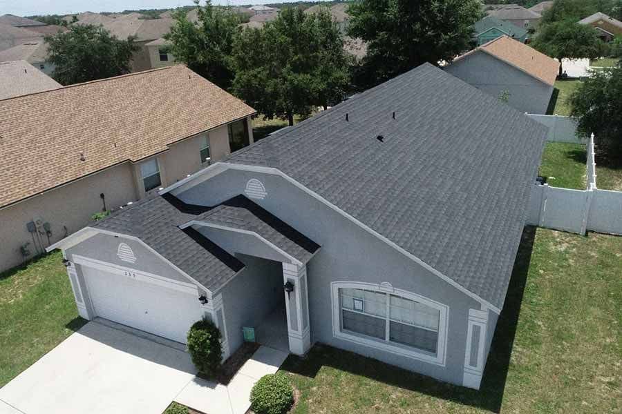 An aerial view of a house with a new roof.