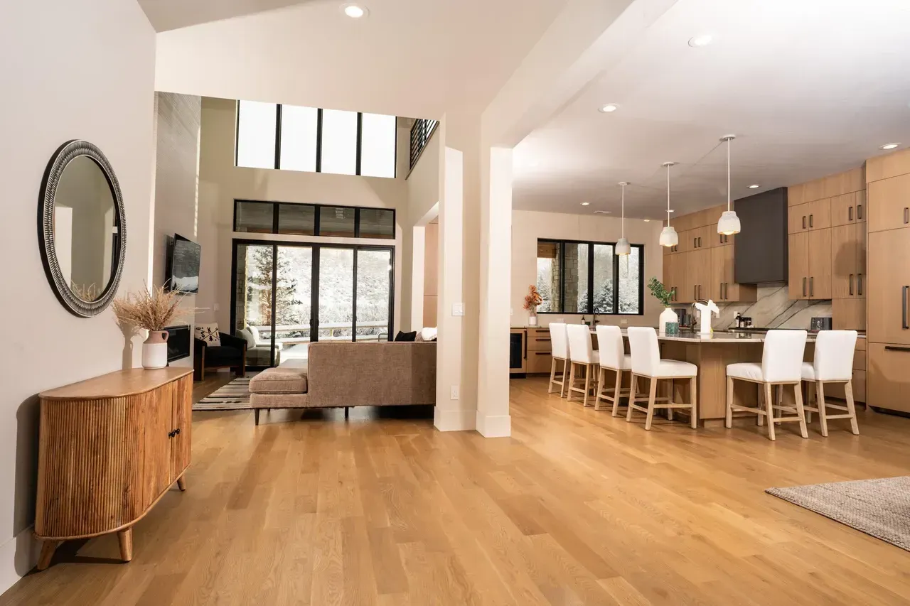 Living room with fireplace, bookshelves on either side, and artwork above the mantel.