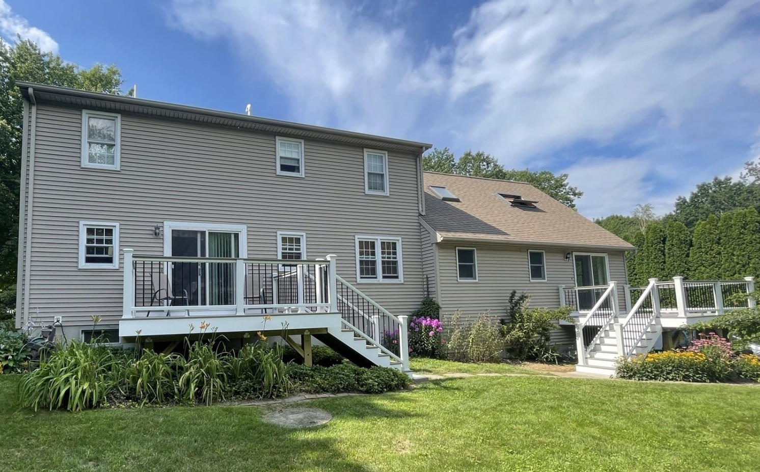 The back of a house with a deck and stairs