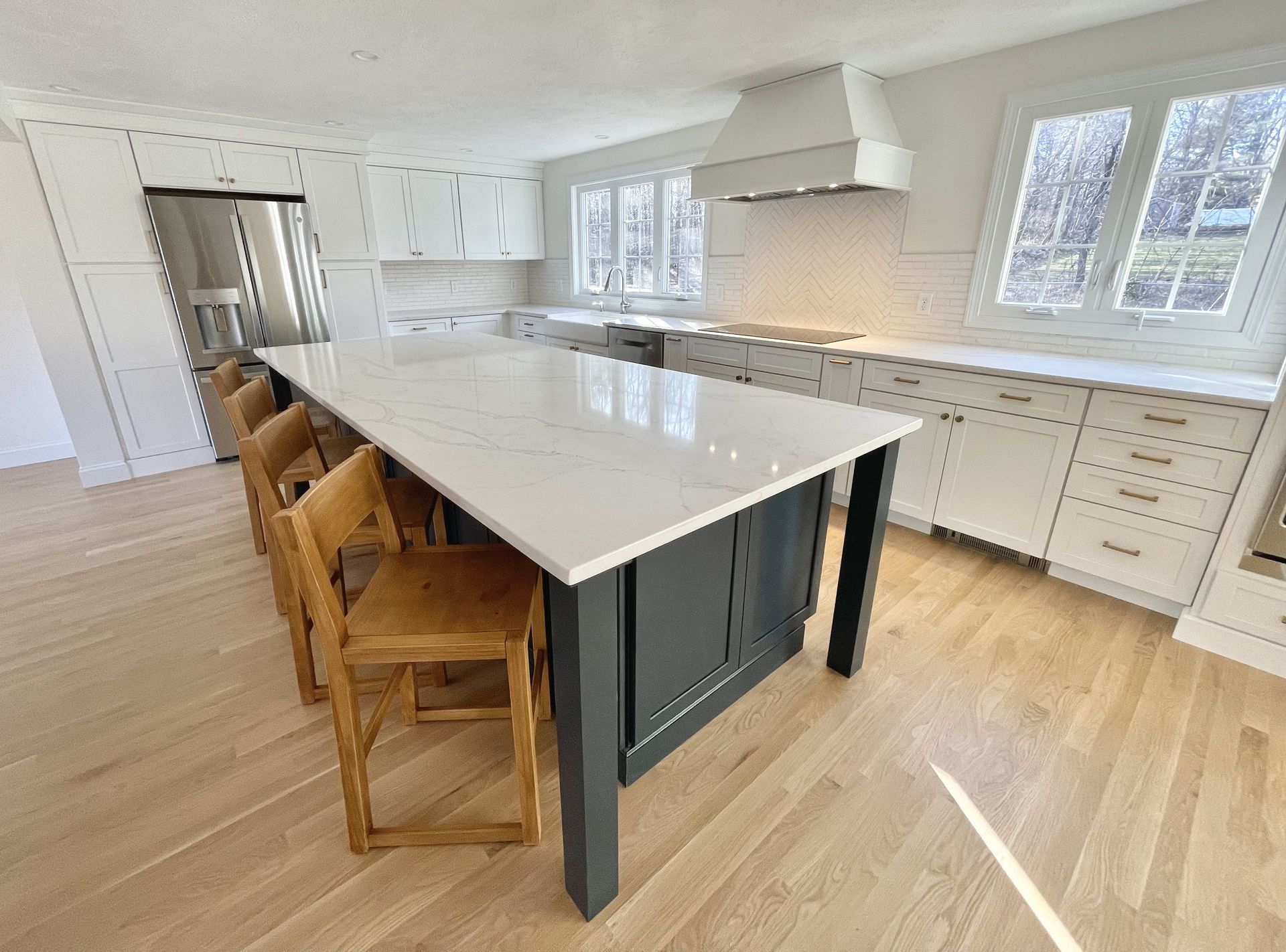 There is a large island in the middle of the kitchen.