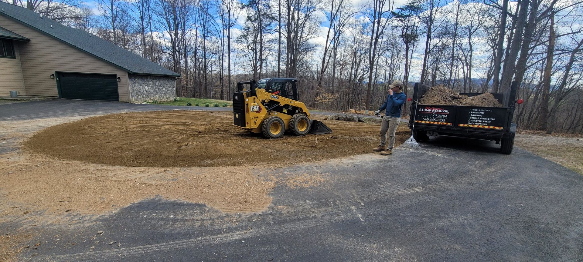 a yellow trx stump grinder grinds stump