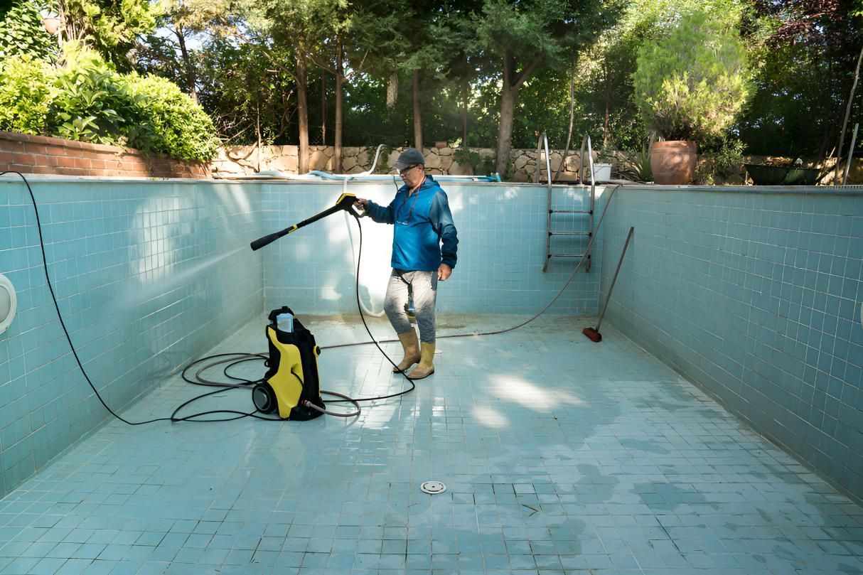 Man is Cleaning Pool in Order to Fill It With Water — Precious Drop Water in Tweed Heads, NSW