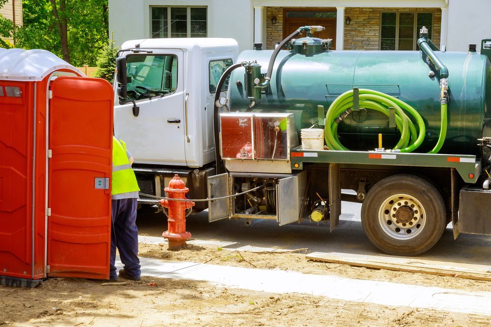 Man is Cleaning Local Portable Toilet With Water Truck — Precious Drop Water in Stokers Siding, NSW