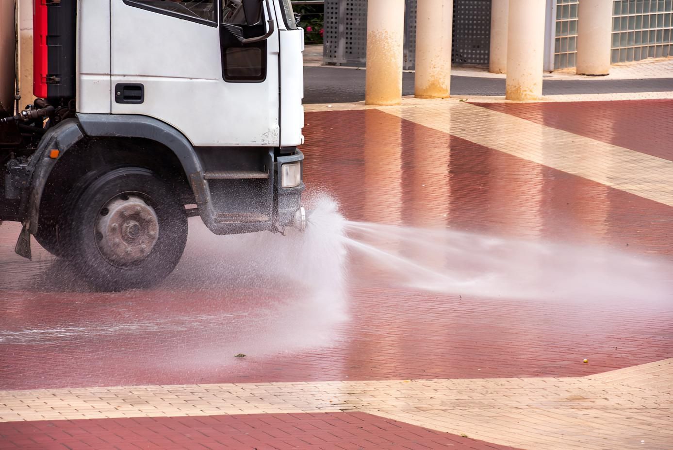 White Truck is Spraying Water on a Brick Sidewalk — Precious Drop Water in Piggabeen, NSW