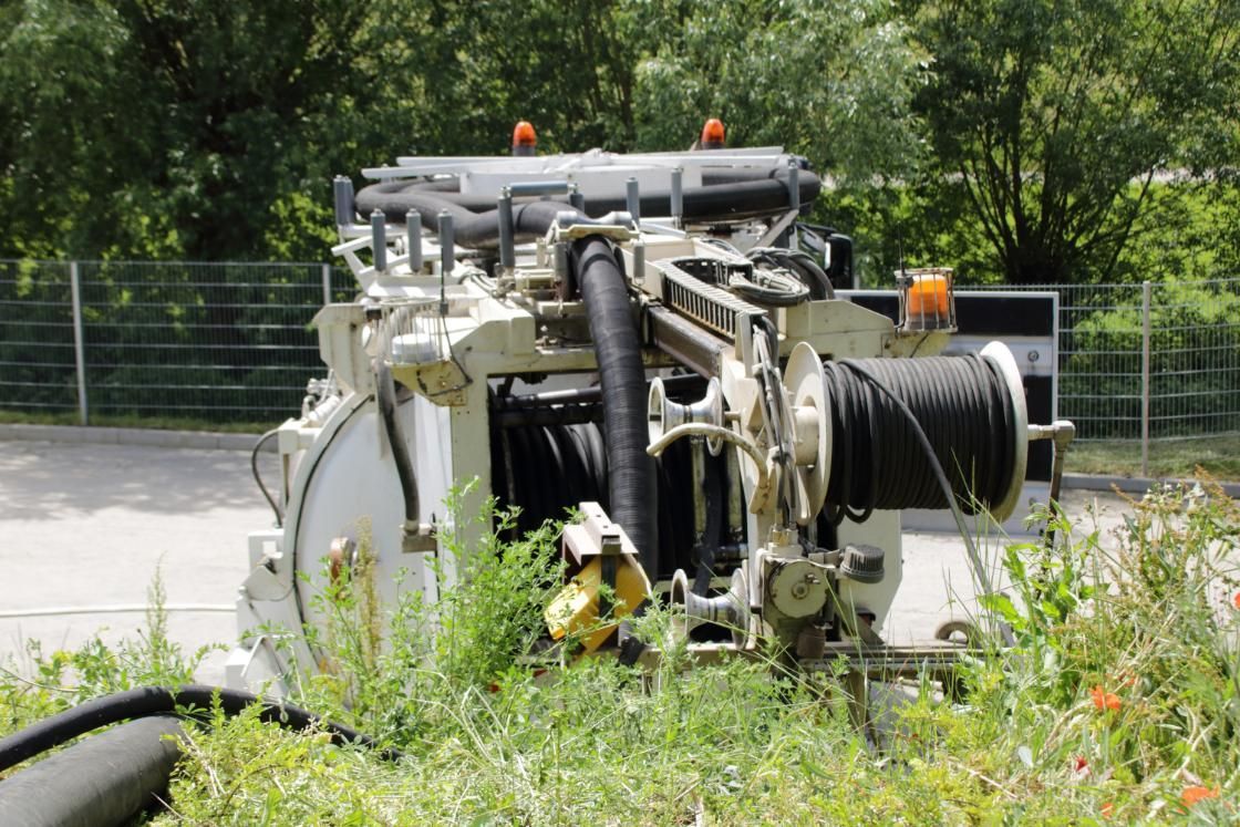 Large Machine is Sitting in the Grass in Front of a Fence — Precious Drop Water in Stokers Siding, NSW