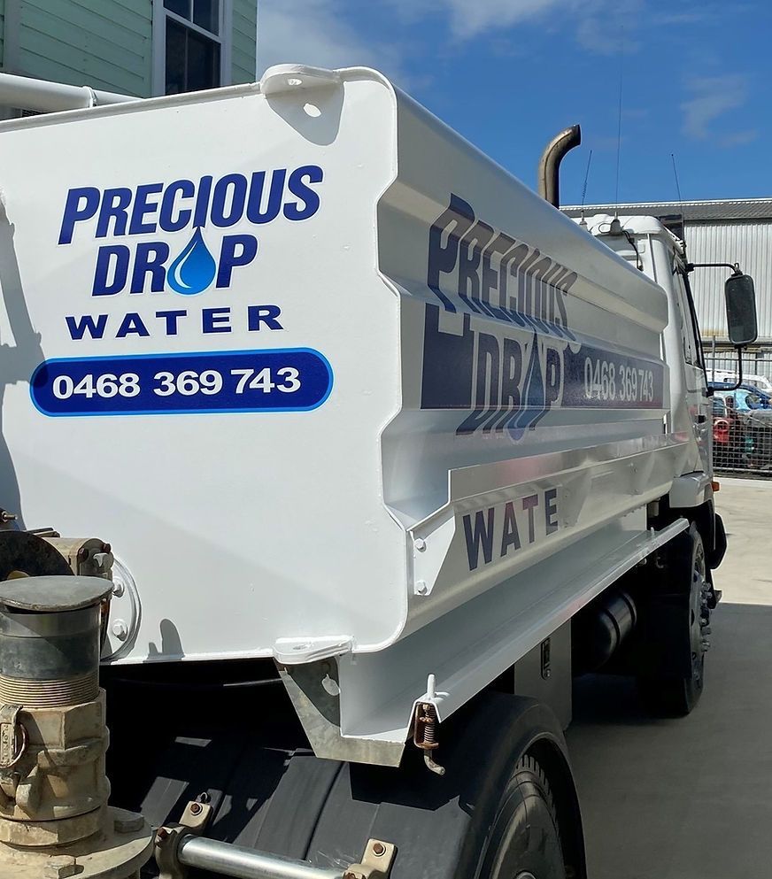 White Truck That Says Precious Drop Water on the Side — Precious Drop Water in Stokers Siding, NSW