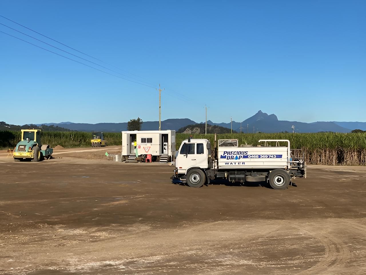 White Truck is Parked in a Dirt Field — Precious Drop Water in Stokers Siding, NSW