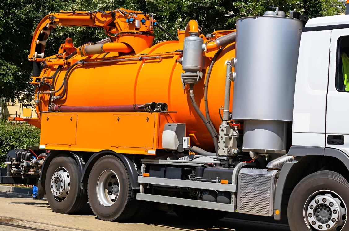 Orange and White Vacuum Truck is Parked — Precious Drop Water in Piggabeen, NSW