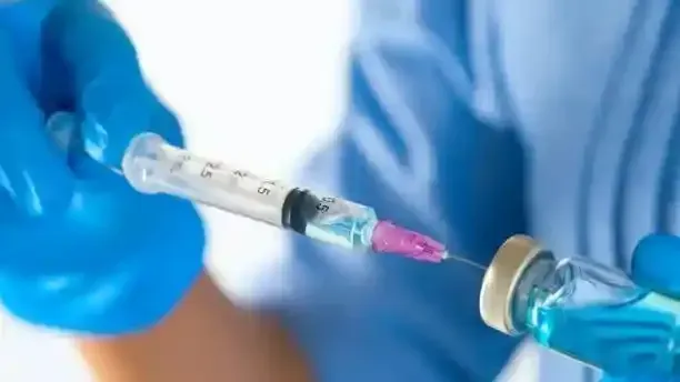  Nurse preparing intramuscular vitamin injection for patient in London, Nurse Agnes service  are  professional and safe , trusted company CQC Registered  
