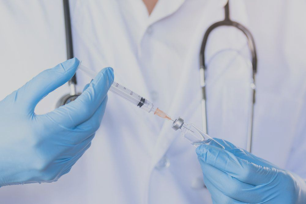 Profesional CQC register nurse giving medical injection in London clinic or at home , Nurse Agnes 