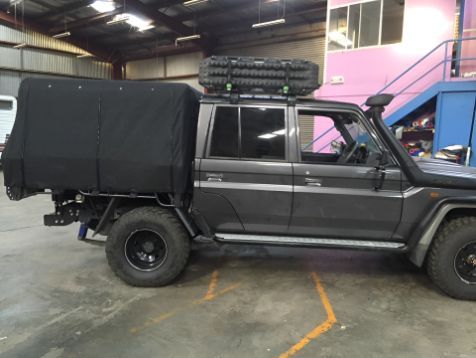 A Truck With A Canopy On Top Of It Is Parked In A Garage — Western Tarps and Motor Trimming In Dubbo, NSW
