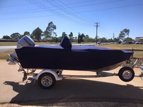 A Boat With A Cover On It Is On A Trailer — Western Tarps and Motor Trimming In Dubbo, NSW