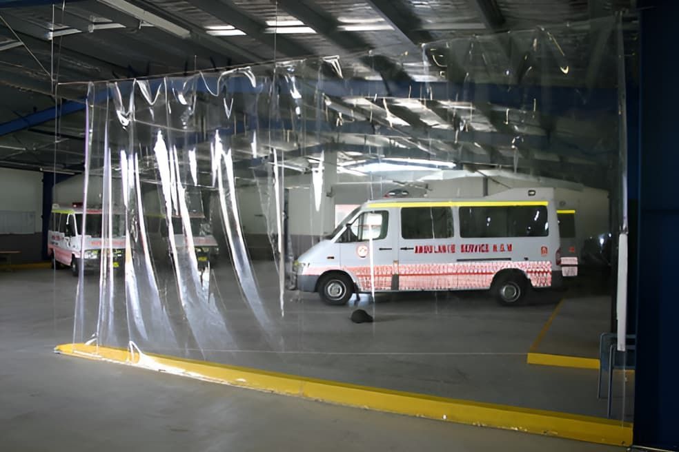 Ambulance Is Parked In A Garage With A Clear Curtain — Western Tarps and Motor Trimming In Dubbo, NSW