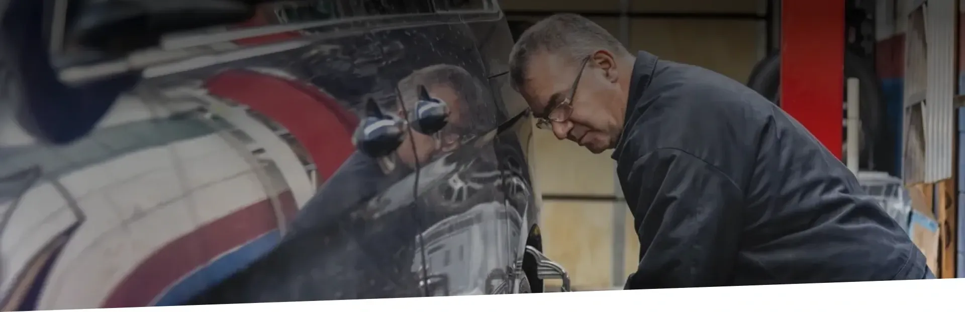 Staff working on vehicle in garage | Van Dorn Auto Repair