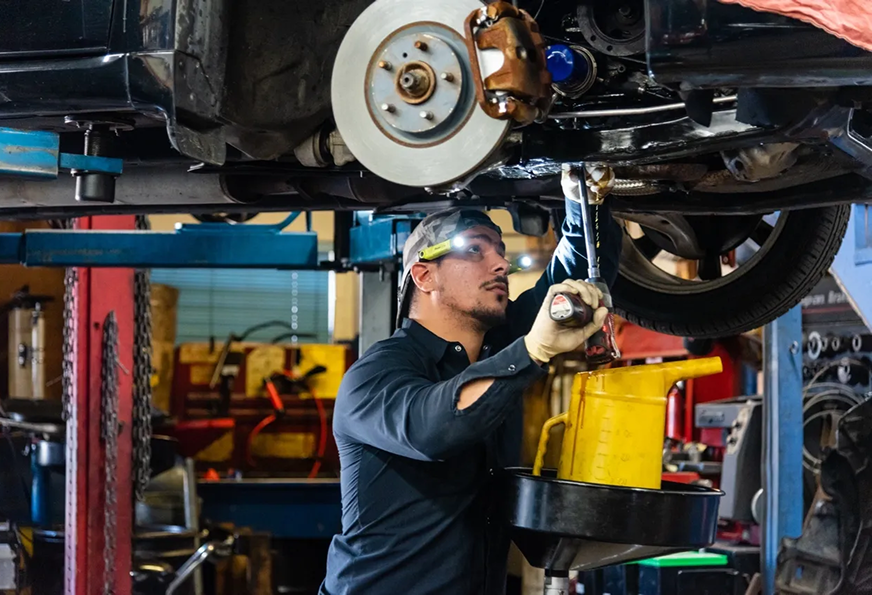 Man working underneath vehicle | Van Dorn Auto Repair