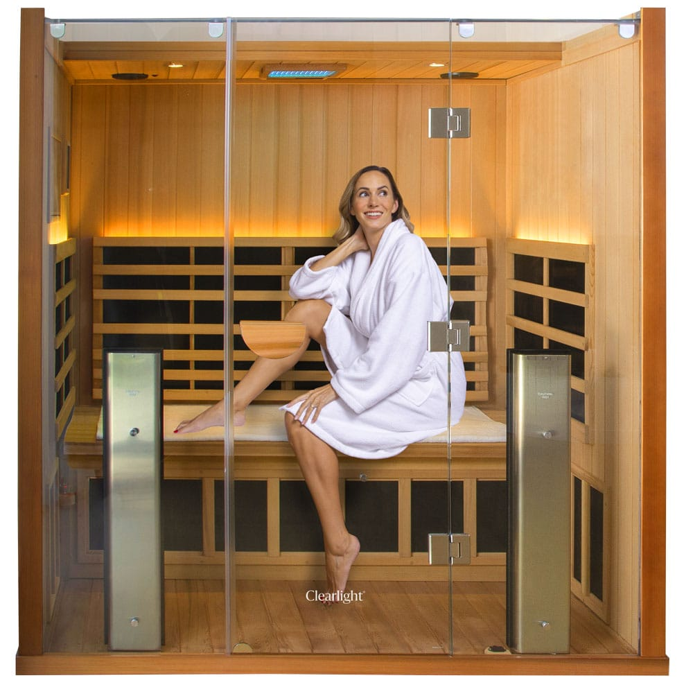Photo of a smiling woman in an infrared sauna
