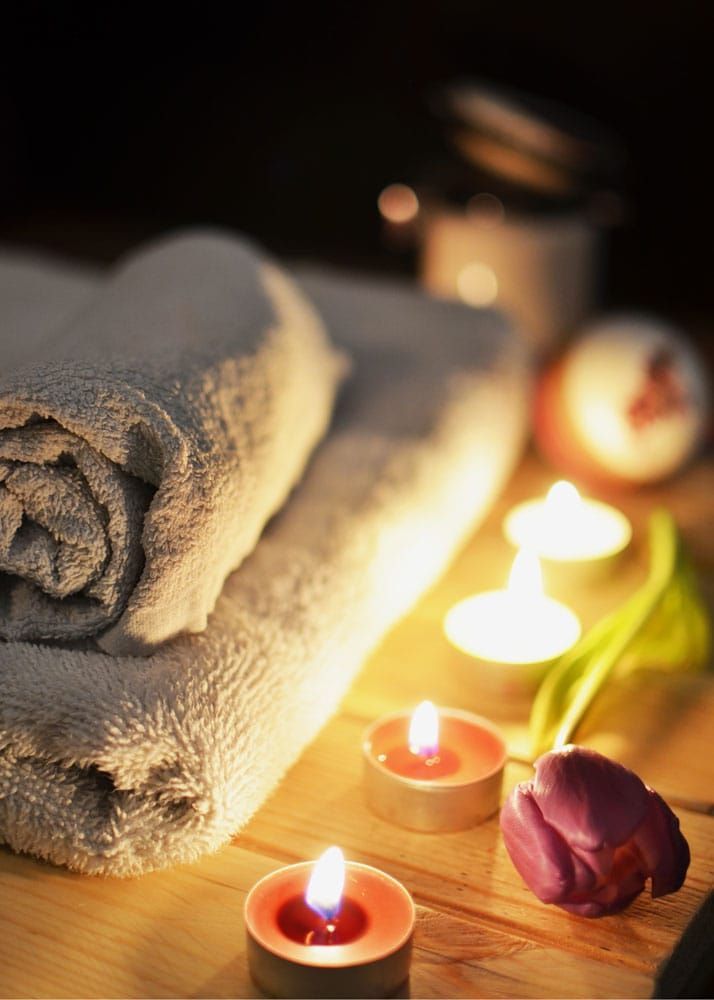 Photo of towels, flowers, and candles