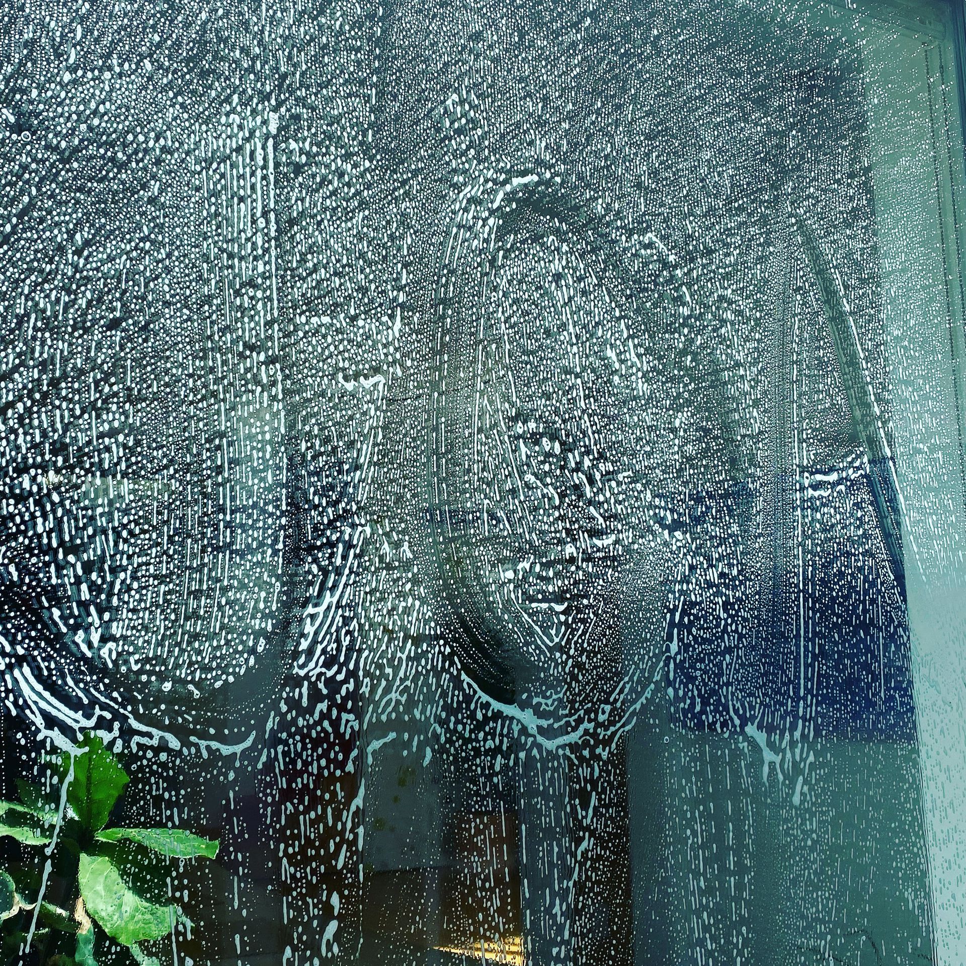 a close up of a window with soap bubbles on it