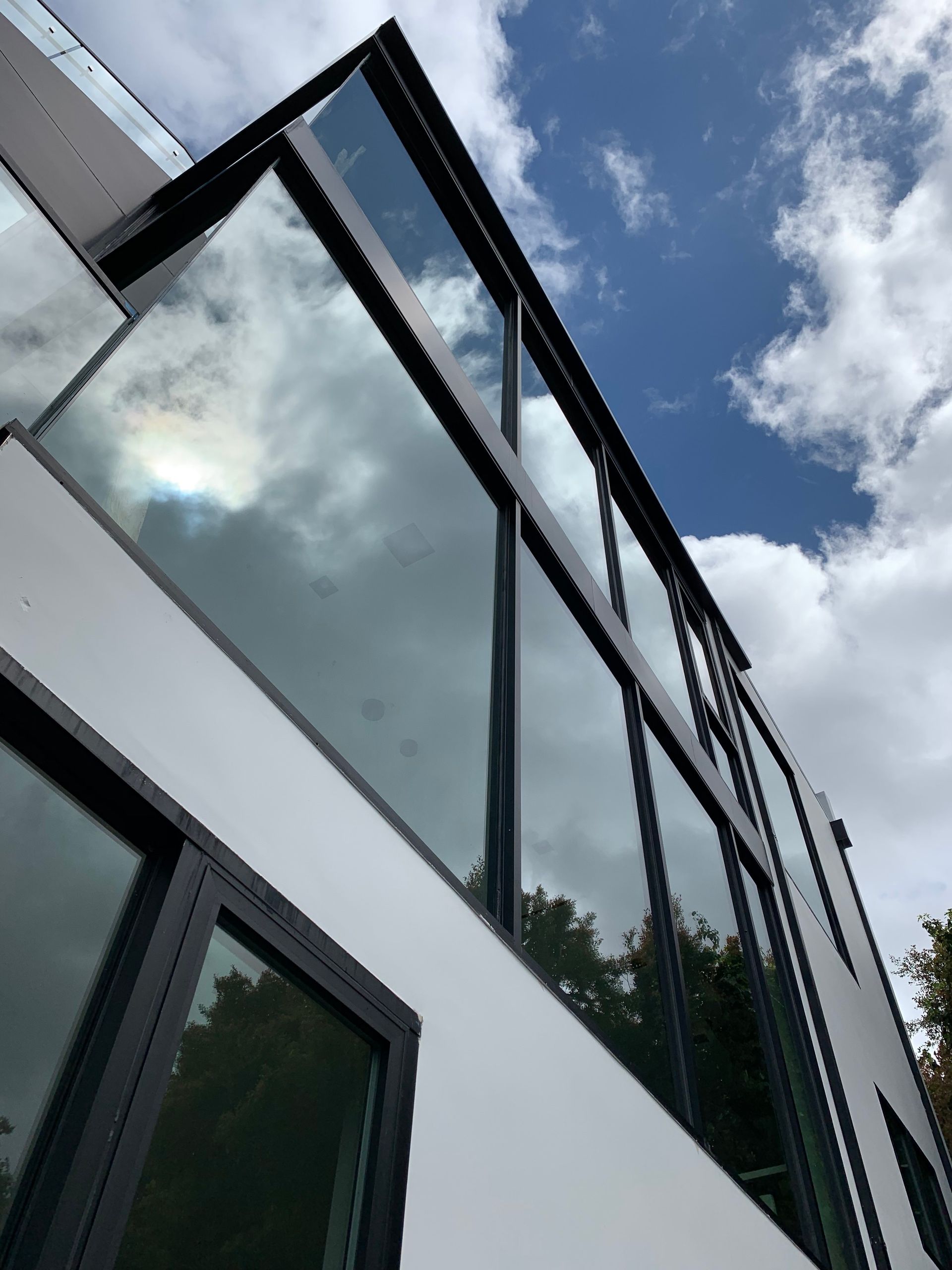 a building with a lot of windows and a blue sky in the background