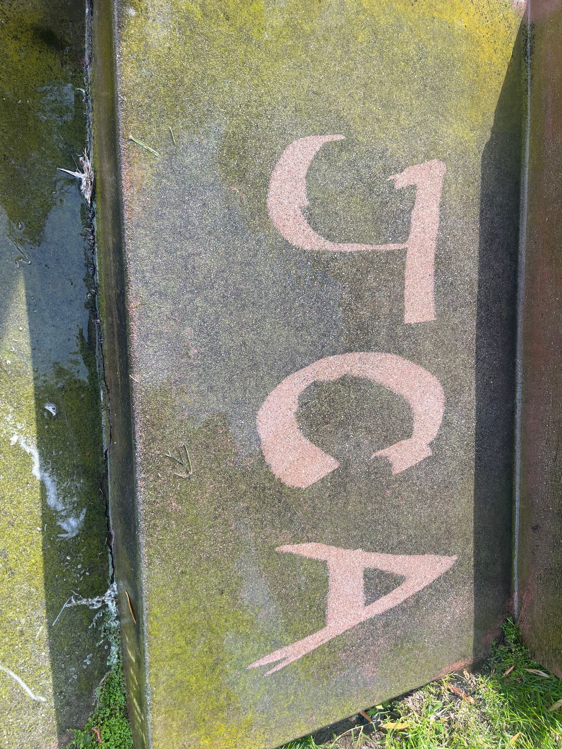 a close up of a gravestone with the name jca written on it
