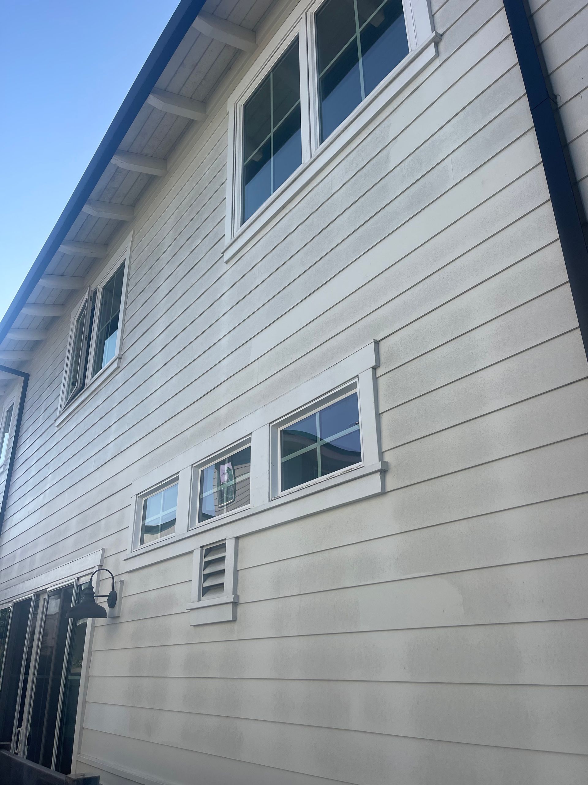 a white house with a lot of windows on it