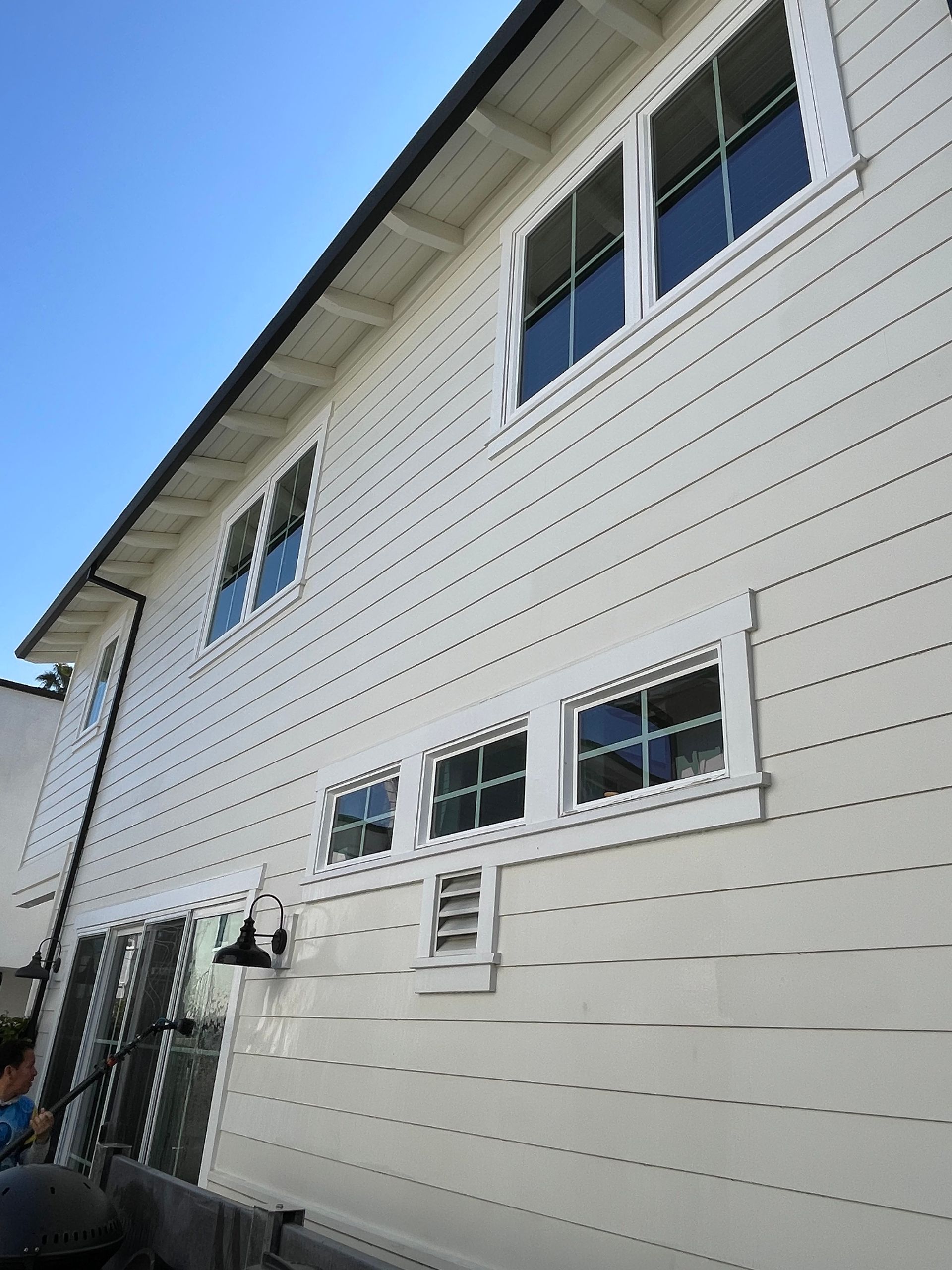 a white house with a blue sky in the background