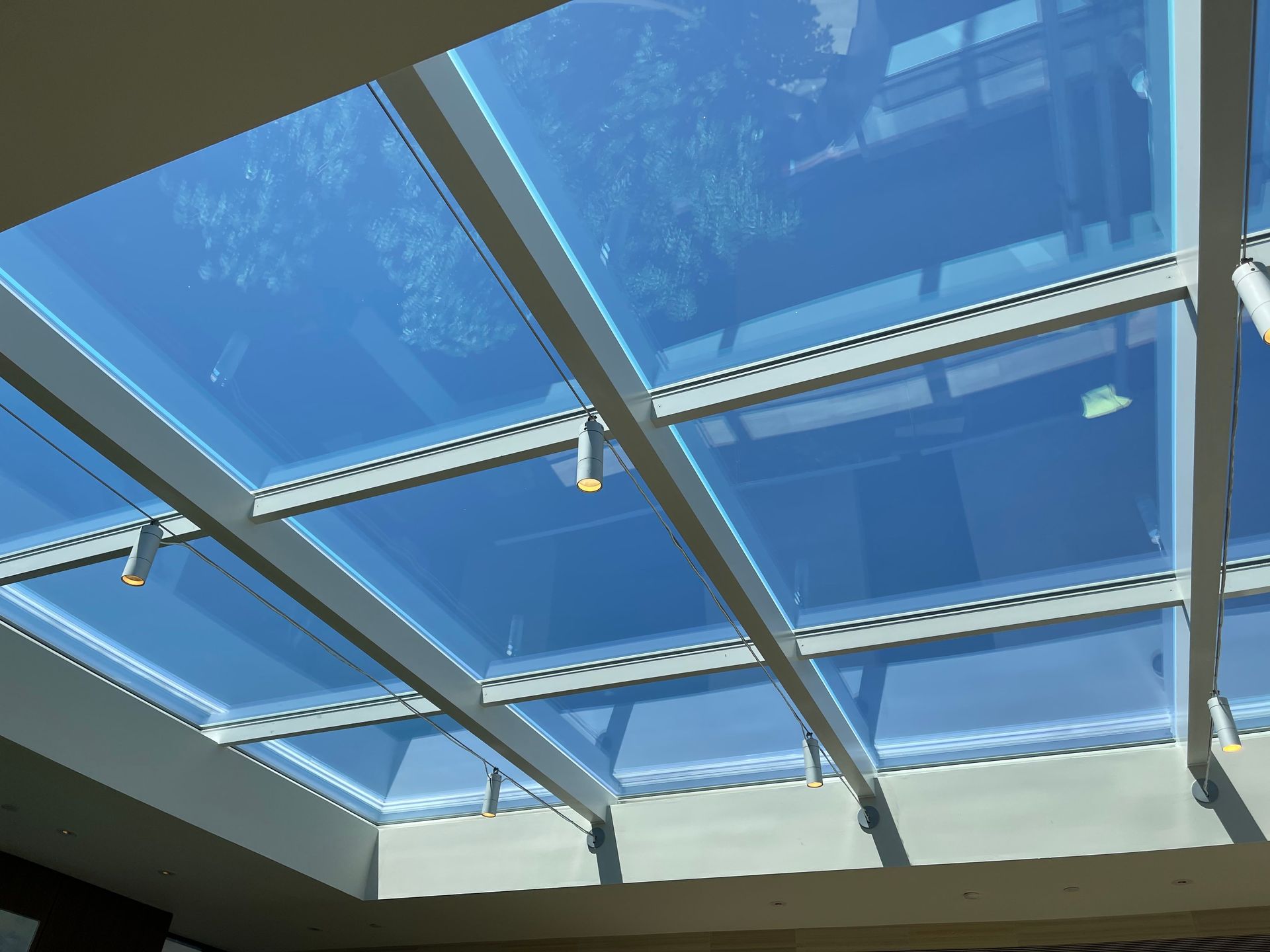 a skylight with a blue sky behind it