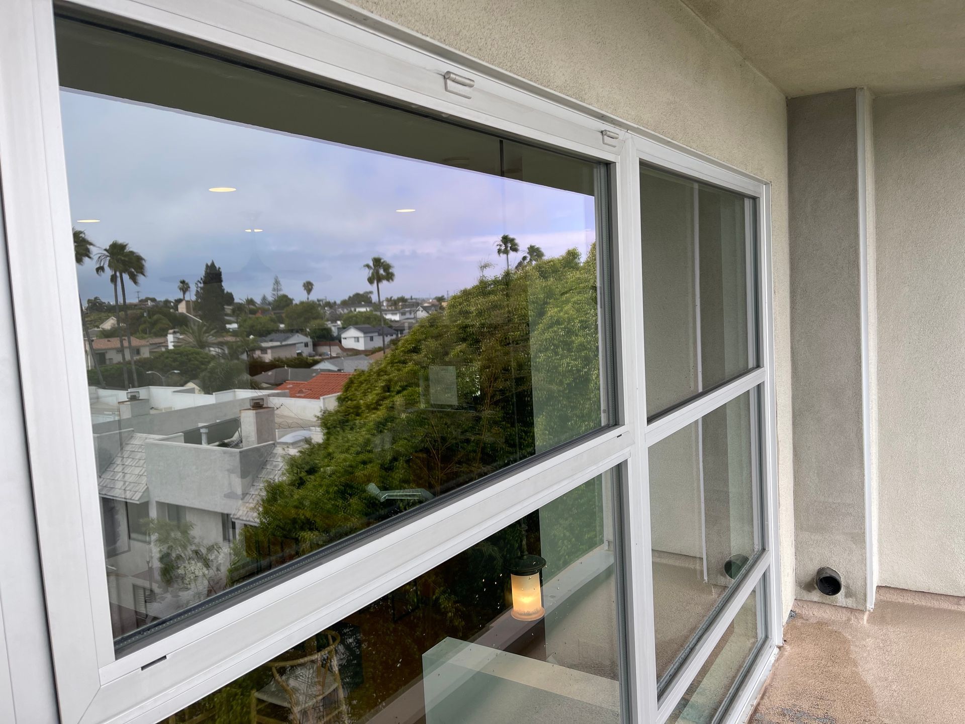 a large window with a view of a city