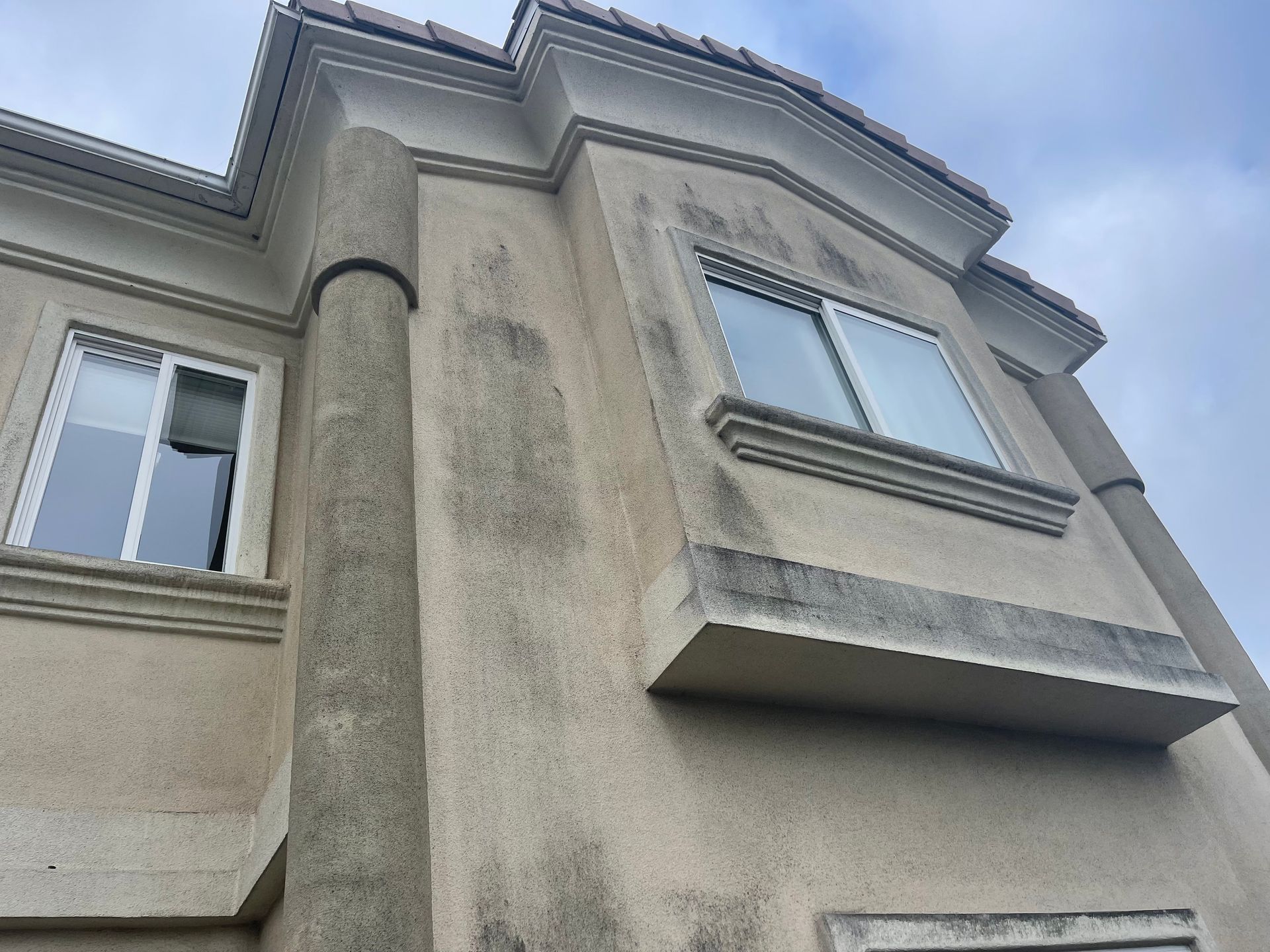 a building with a lot of windows and a blue sky in the background