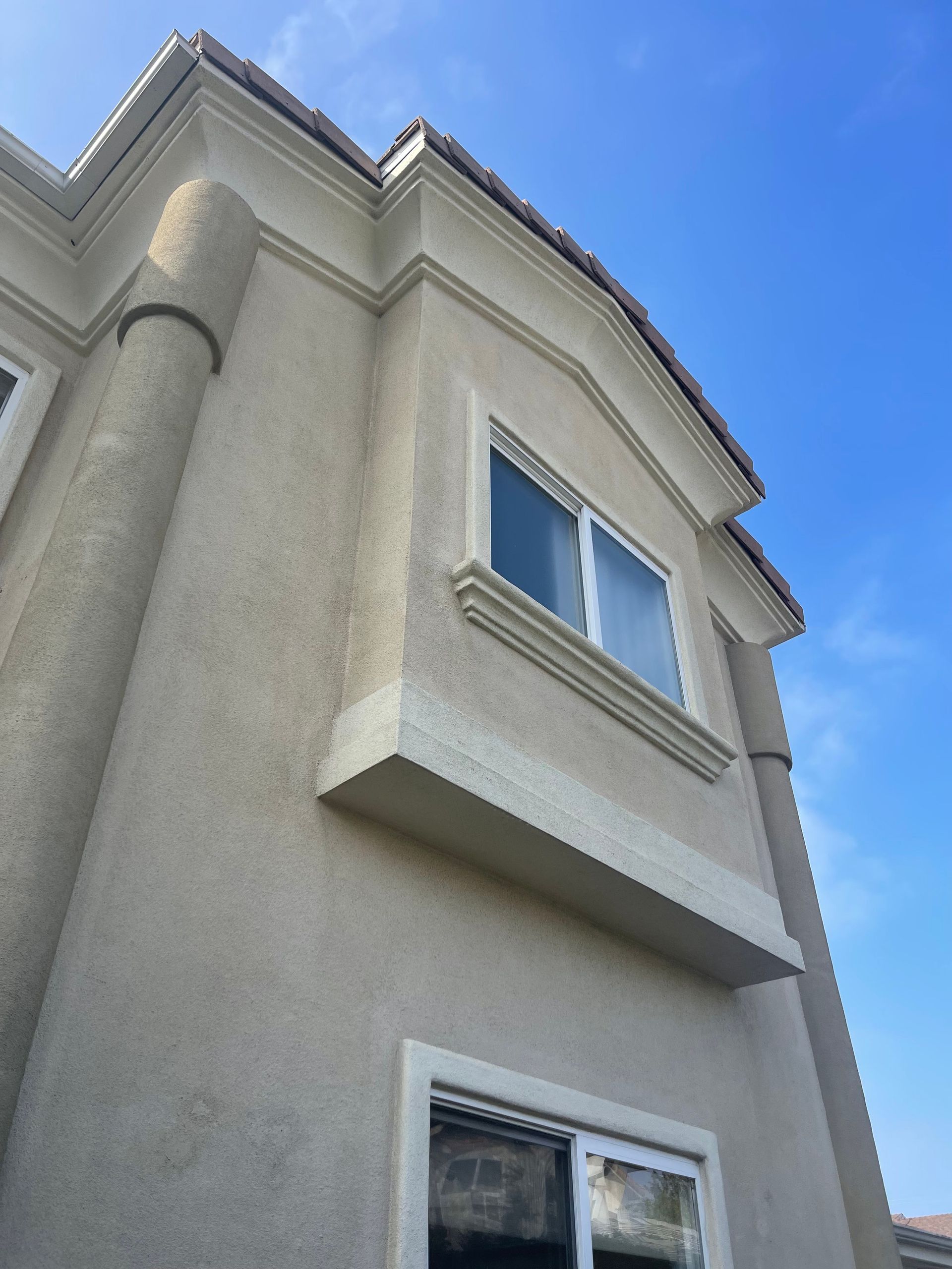 a building with a blue sky in the background