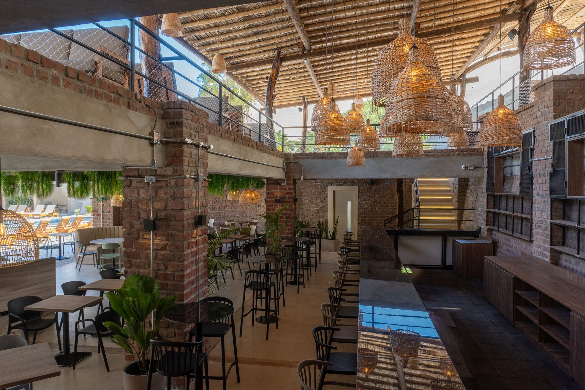 A rendering of a restaurant with tables and chairs and a bar.