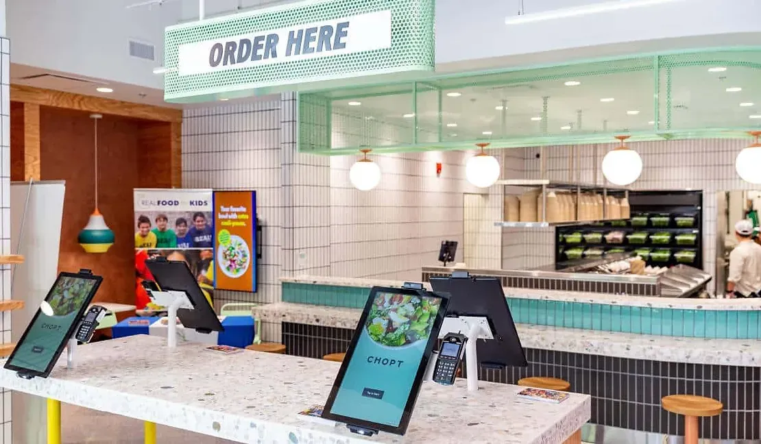 A restaurant with a sign that says `` order here ''.