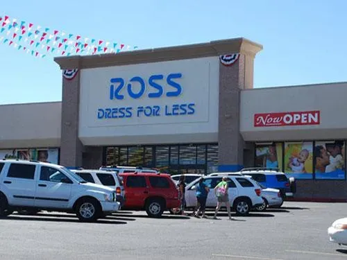 Cars are parked in front of a ross dress for less store