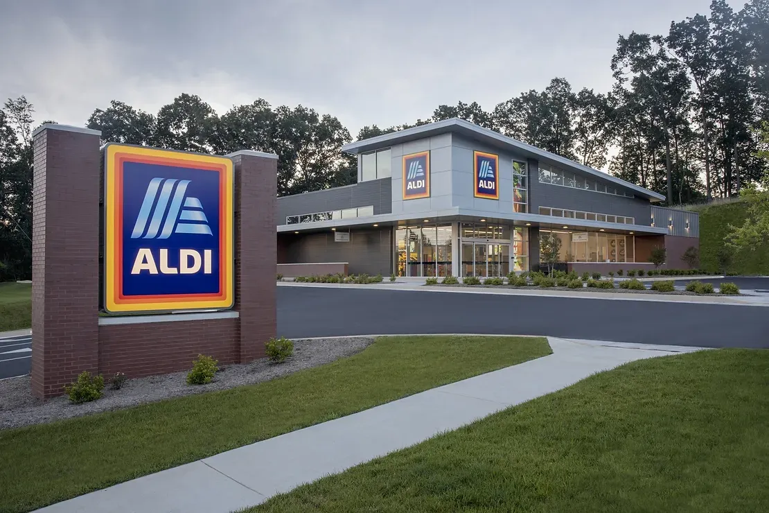 An aldi store with a sign in front of it