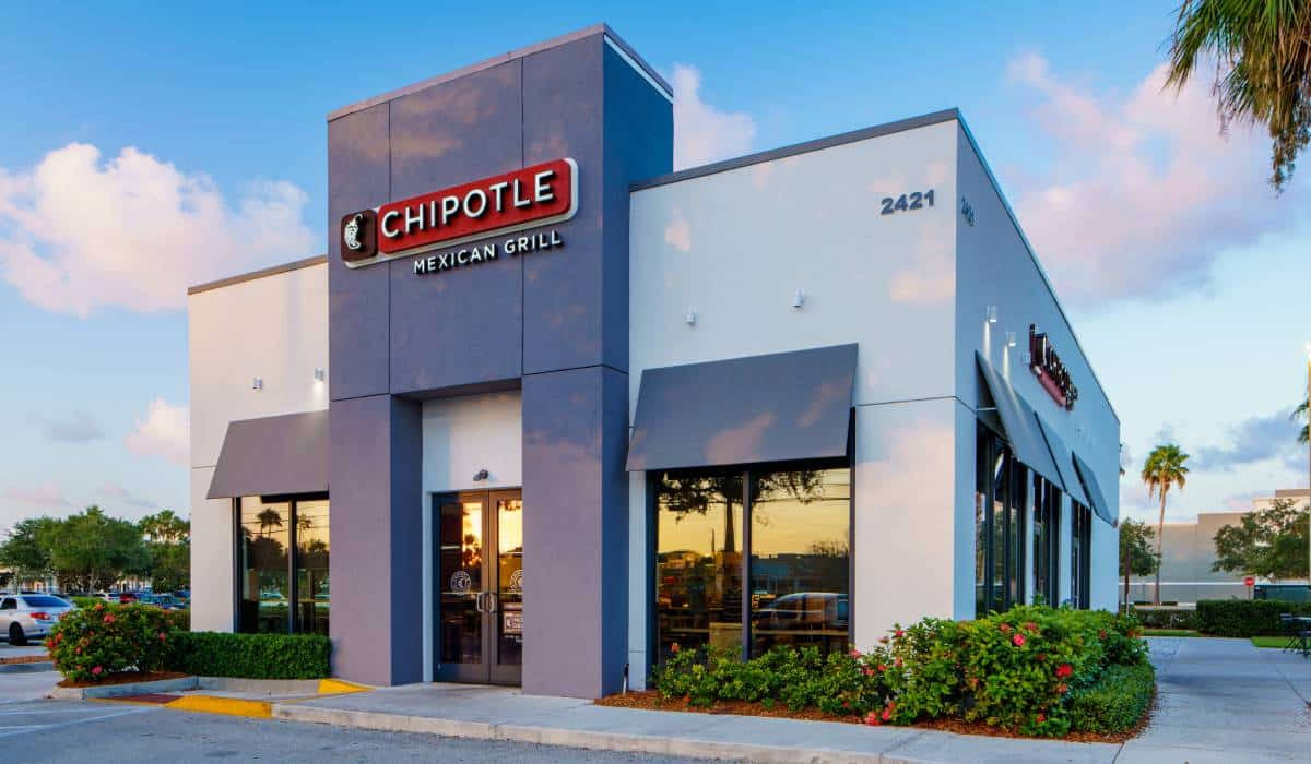 A chipotle restaurant is located in a residential area.