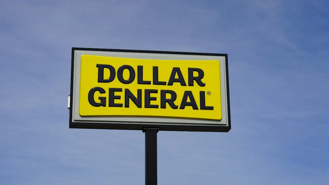 A dollar general sign against a blue sky