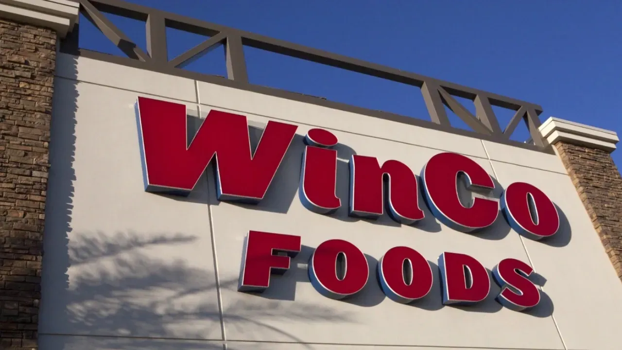 A winco foods sign is on the side of a building
