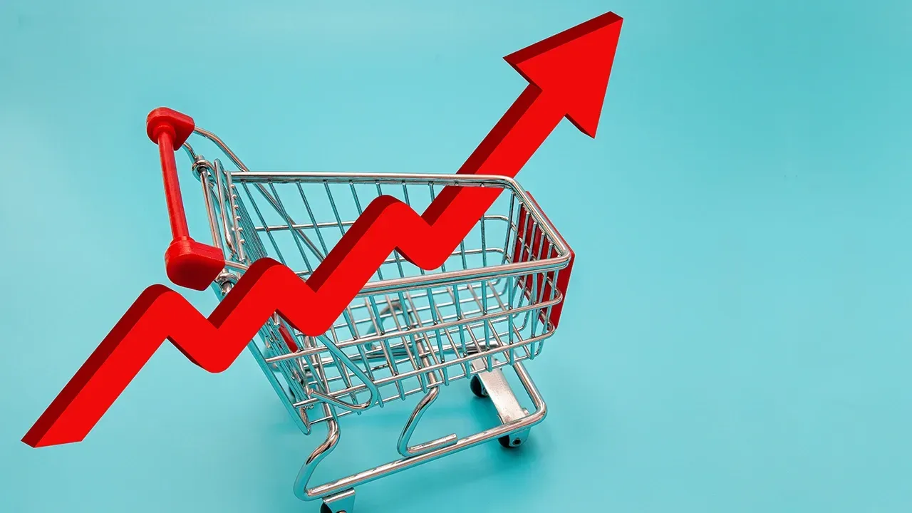 A shopping cart with a red arrow pointing upwards.