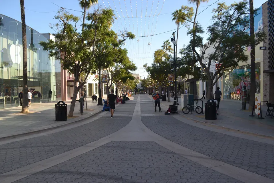 A car is parked in front of a sign that says 223