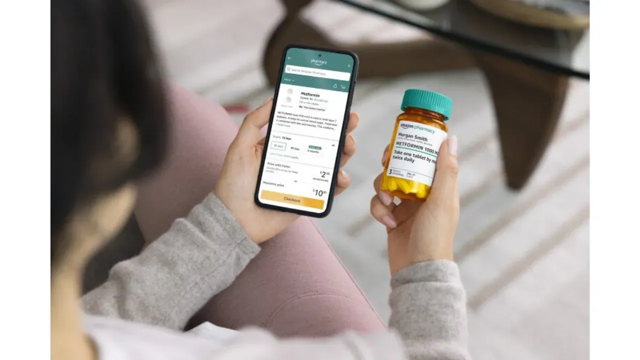 A woman is holding a bottle of pills and a cell phone.