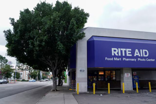 A rite aid store with a tree in front of it