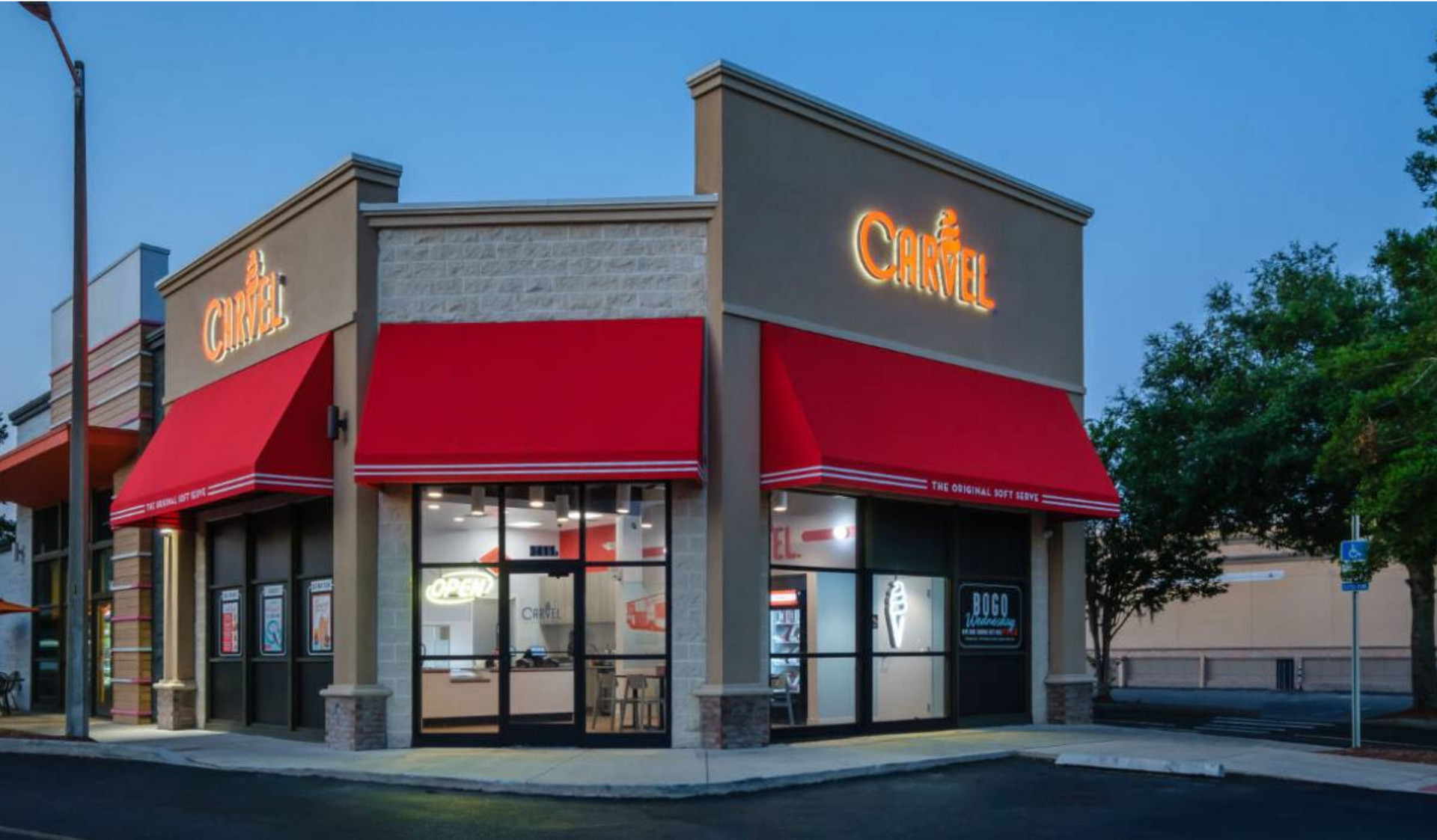 A building with a red awning that says cafe on it