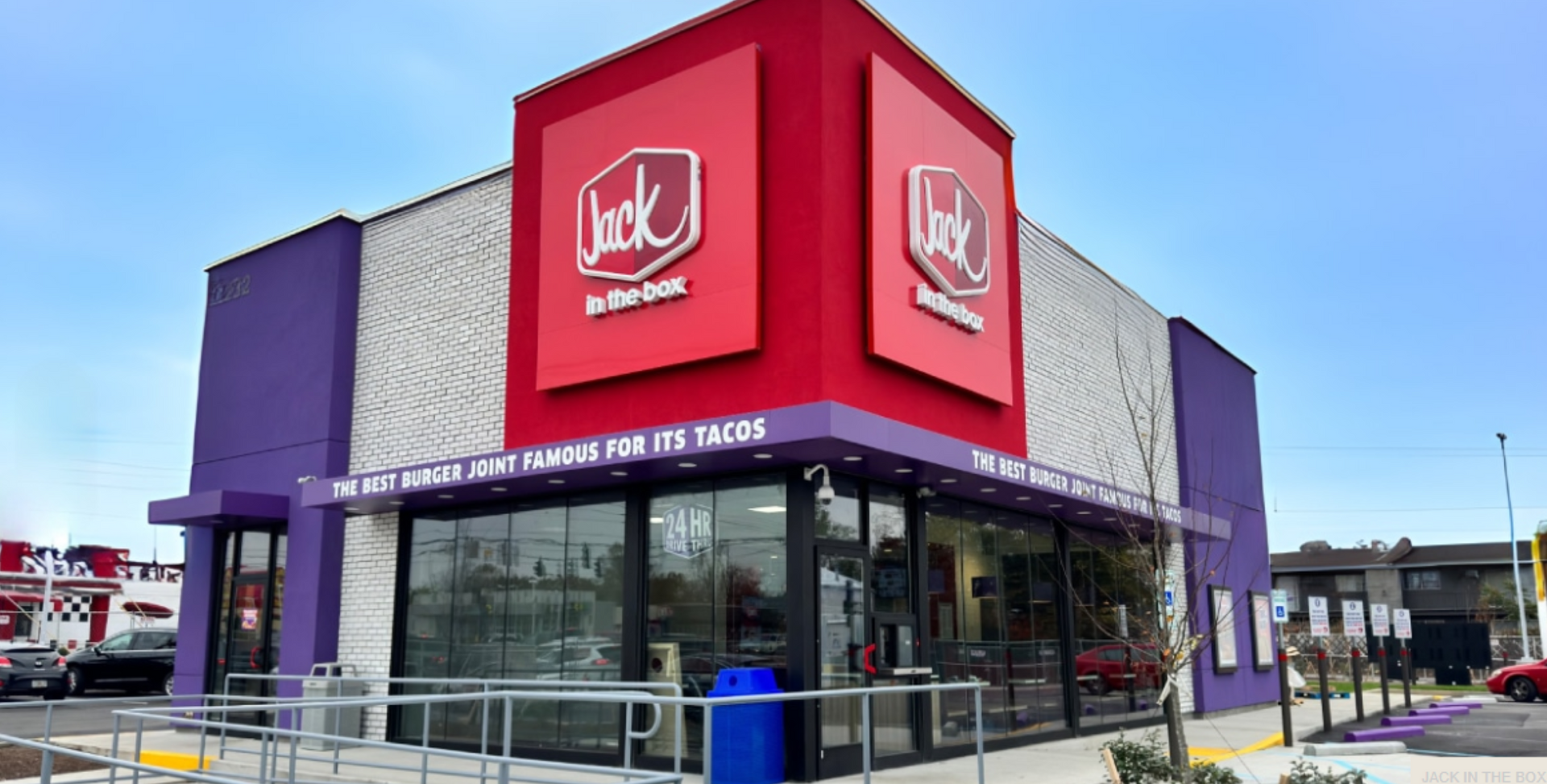 A jack in the box restaurant with a purple and white building.