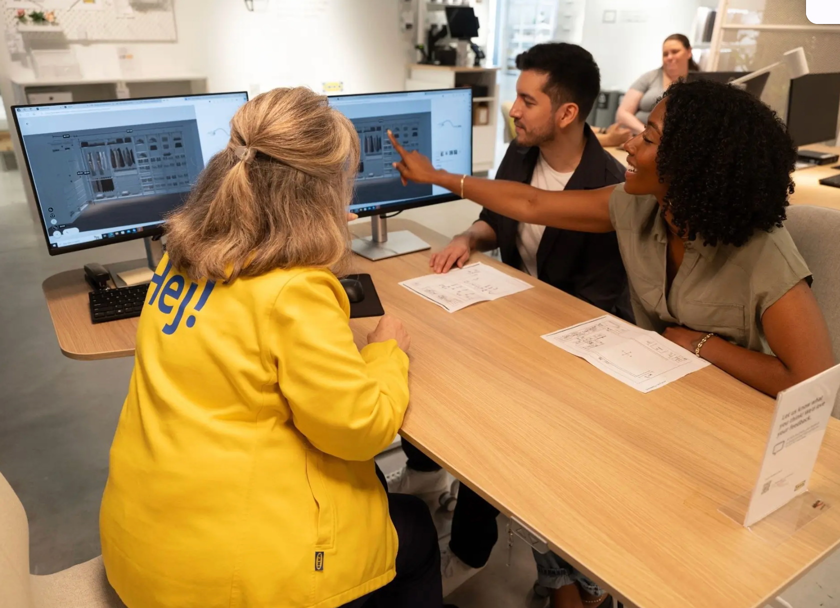 A blurry picture of a clothing store with clothes on display.