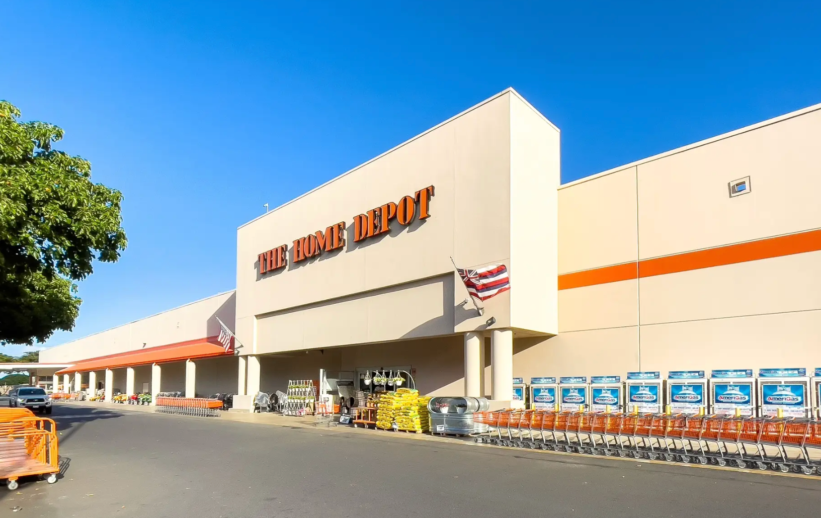 The front of an aldi store with a sign in front of it.