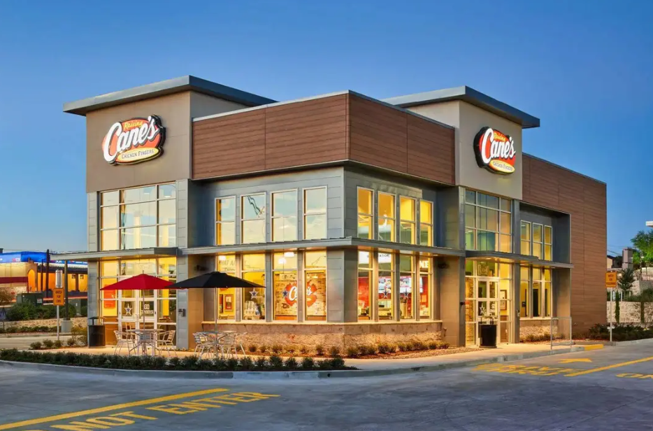 A blurry picture of a clothing store with clothes on display.